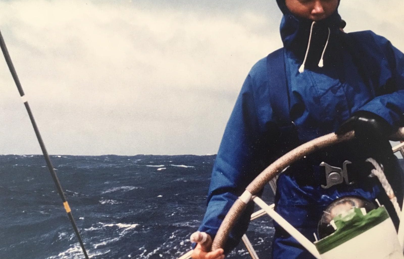 person sailing across the atlantic at the helm