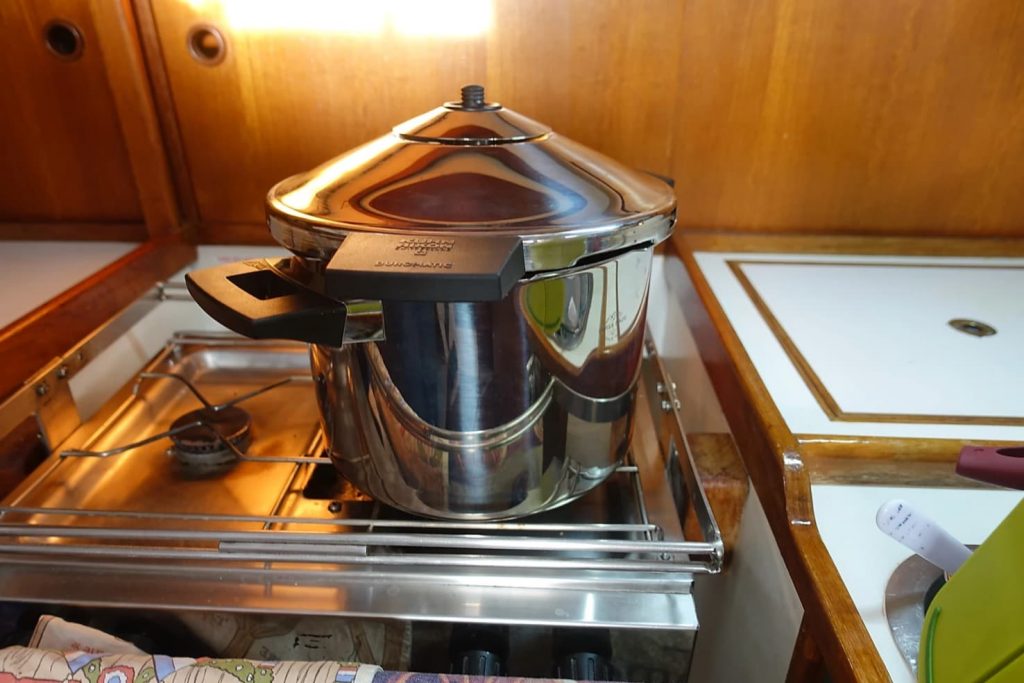 pressure cooker on a boat galley kitchen stove