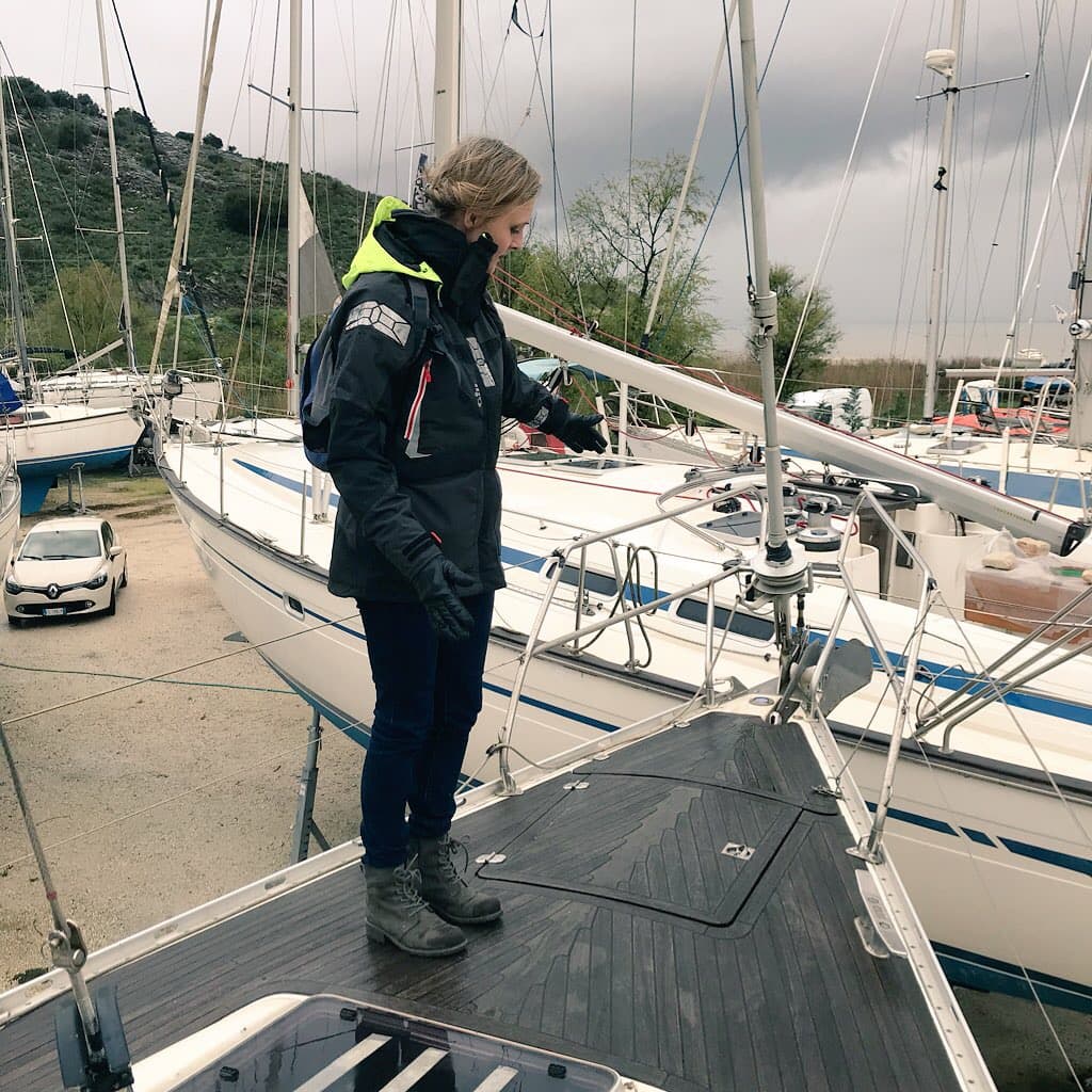 person stood on bow of boat