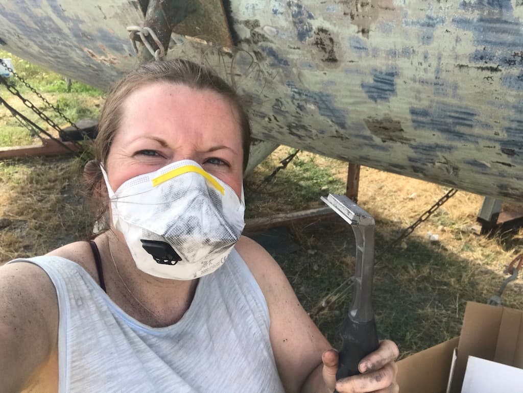 girl scraping back the hull